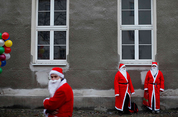 Young men dressed in Santa Claus costumes attend the annual Santa Claus parade in Brandenburg, Germany.

