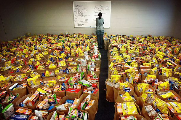 A volunteer tracks bags of groceries collected for distribution at the Assembly of God church in Memphis, Tennessee. 

