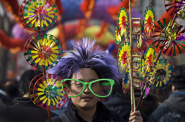 A vendor sells hand-made fans at the Longtan Temple fair during the Chinese New Year celebration in Beijing, China.

