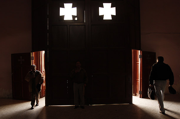 Worshippers enter and leave a Catholic church on Ash Wednesday in La Paz, Bolivia.

