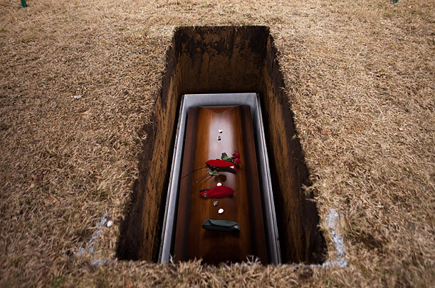 The coffin of Staff Sgt. Timothy P. Davis rests in a grave during the soldier's funeral in Montesano, Washington. Davis died while serving in Afghanistan.

