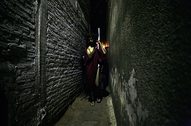 A Paraguayan actor, portraying Jesus Christ, takes part in a re-enactment of the Via Crucis, or Way of the Cross, during Holy Week in Asuncion.
