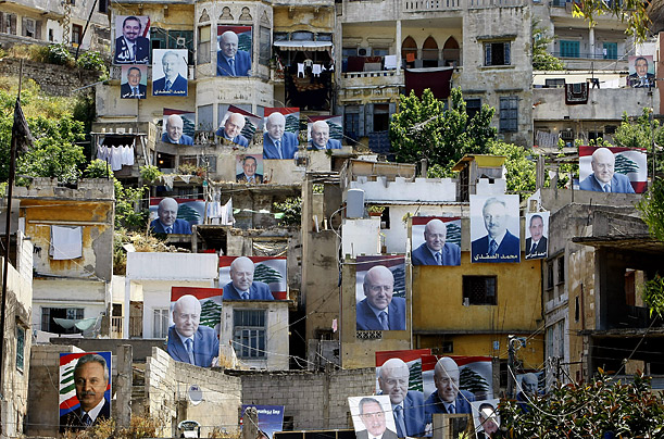 Posters of Lebanese candidates for the June 7 parliamentary elections cover the facades of buildings in Tripoli.