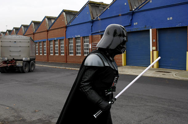 A man dressed as Darth Vader arrives for the launch of an exhibition in Melbourne that showcases an array of costumes