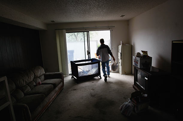 An eviction team in Lafayette, Colorado removes bags of belongings from an apartment whose tenants had failed to pay rent.