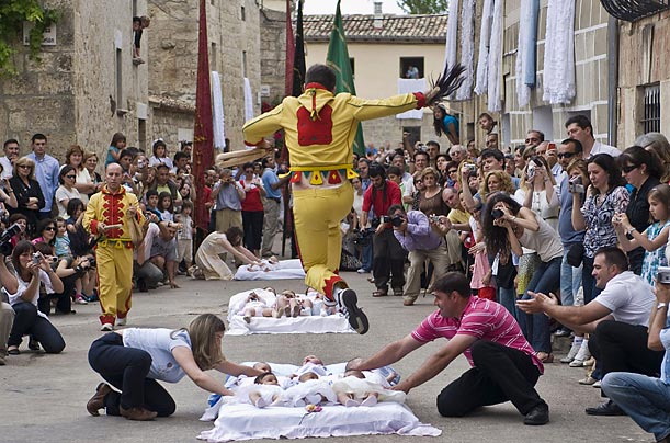 The northern Spanish town of Castrillo de Murcia has for centuries protected its young from evil spirits with an unusual ritual in which a man dressed as the devil leaps over mattresses that hold several babies.