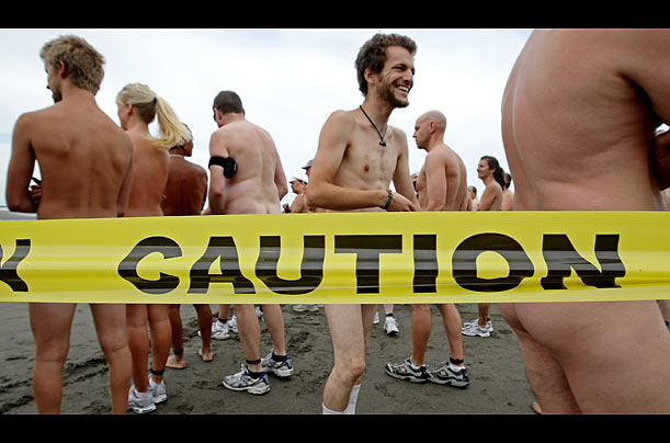 Competitors gather before the start of the Bare Buns Run, a 5-km clothing optional run, at Wreck Beach in Vancouver, Canada.
