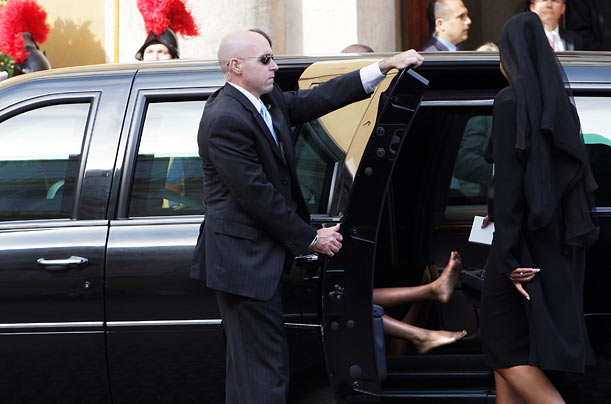 First Lady Michelle Obama meets her daughters in a limousine after her meeting with Pope Benedict XVI in Vatican City.