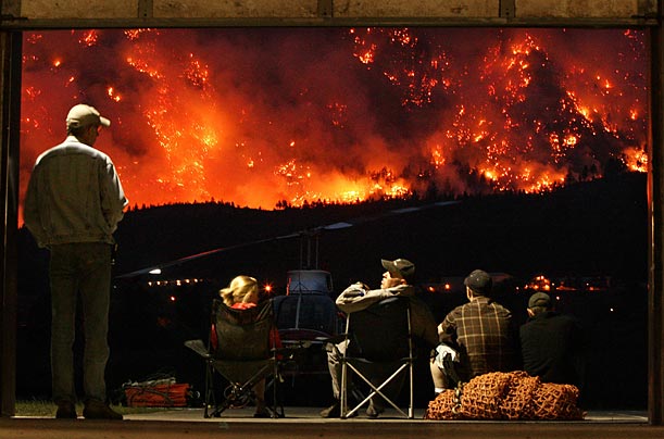 Helicopter pilots watch as a controlled fire burns on Mount McLean, British Columbia. The fire was created in an attempt to reduce the amount of fuel feeding a wildfire on the mountain in Lillooet.
Helicopter pilots watch as a controlled fire burns on Mount McLean, British Columbia. The fire was created in an attempt to reduce the amount of fuel feeding a wildfire on the mountain in Lillooet.