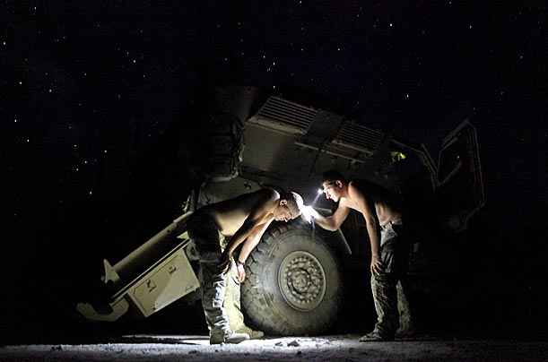 BrotherhoodSgt. Joshua Engbrecht and Pfc. Jack Shortridge give each other haircuts under the stars at Combat Outpost Tangi in Afghanistan