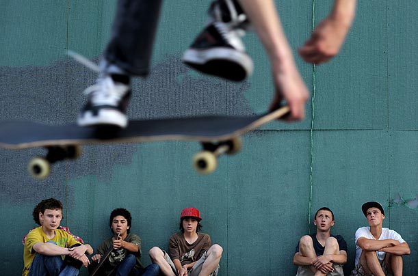 Up, Up and Away Russian skateboarders watch one of their friends perform a trick in central Moscow.