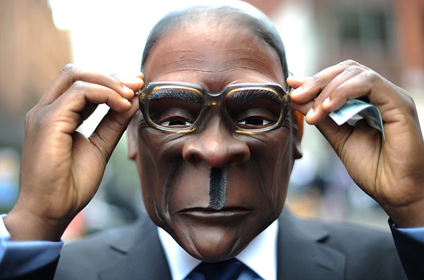 Face of Oppression
A person wearing a mask resembling Zimbabwe's president Robert Mugabe stands outside Harrods retail store in London