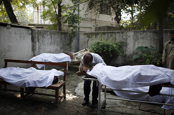 Mourning
A man cries over the body of his brother, a victim of a bombing, at a local hospital in Rawalpindi, Pakistan.