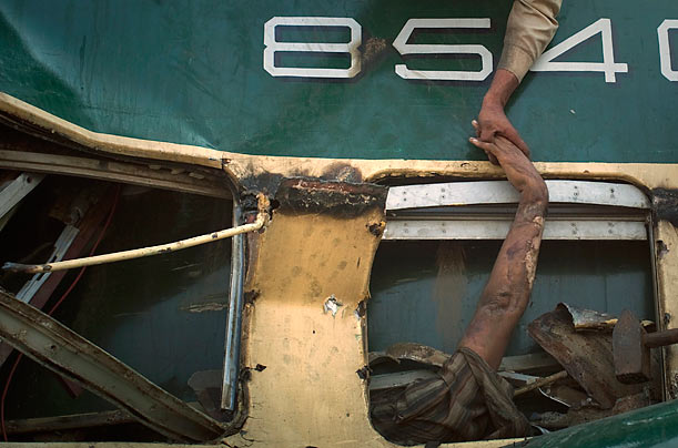 Rescue Effort
A volunteer grabs the hand a victim in a train crash in Karachi, Pakistan.