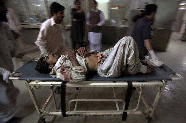 Emergency
Medics assist a man who was injured by a Taliban suicide bomb blast in Charsadda, Pakistan.