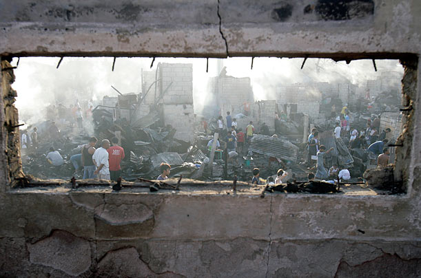 Ruin
Residents try to recover belongings from their charred houses after a fire in Mandaluyong City, Philippines.
