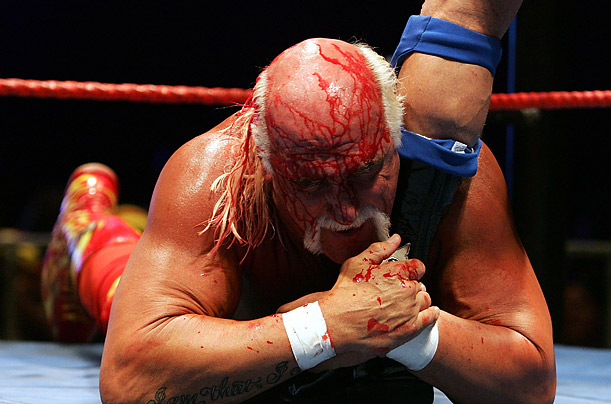 Hulk Hogan grabs the leg of Rick Flair during during his Hulkamania Tour at the Burswood Dome in Perth, Australia.