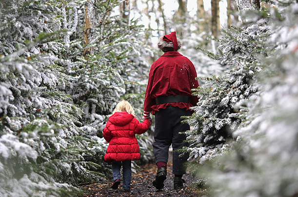 A young girl is taken to visit Santa Claus at Lapland UK in Lamberhurst, England. Lapland UK looks to offer a Christmas experience set in a snow covered forest with real Huskies and Reindeer.