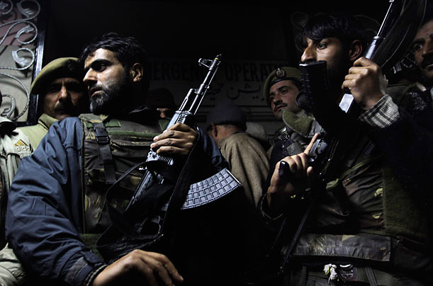 Careful
Police officers stand guard outside the medical center where Fazal Haq Qureshi, a leader of the All Parties Hurriyat Conference, Careful
Police officers stand guard outside the medical center where Fazal Haq Qureshi, a leader of the All Parties Hurriyat Conference,