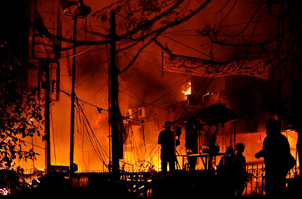 Hellish
Pakistanis gather at the site of a bomb blast in Lahore that killed at least 15 people.