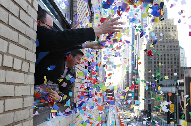 Serious Scientific Inquiry
Volunteers throw confetti out a window in New York's Times Square for the annual 