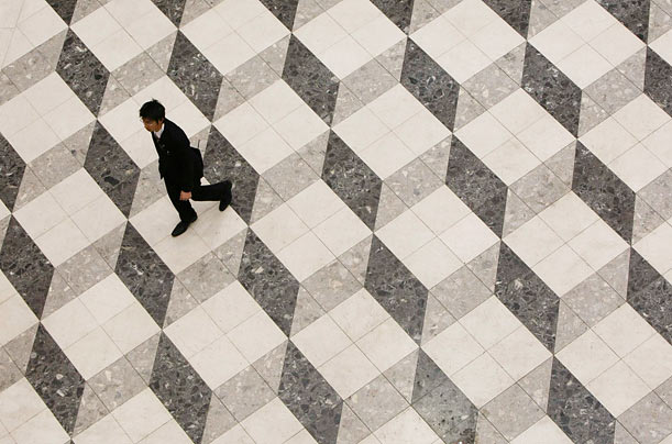Q*bert?
A man walks through a Tokyo building.