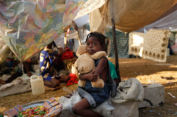 Heartbreaking
Floria Loveng, 7, hugs her teddy bear in a tent city for displaced Haitians.