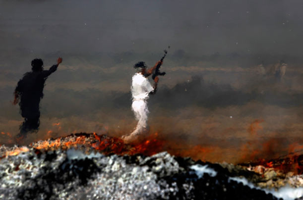 Hands Off
A customs official in Karachi defends a burning pile of seized contraband including heroin, alcohol, pirated DVDs and beetle nut