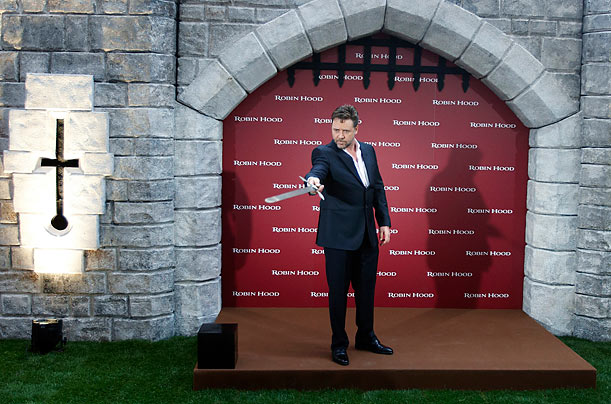 Get the PointRussell Crowe poses with a sword during a photo call in Madrid for his new movie Robin Hood.