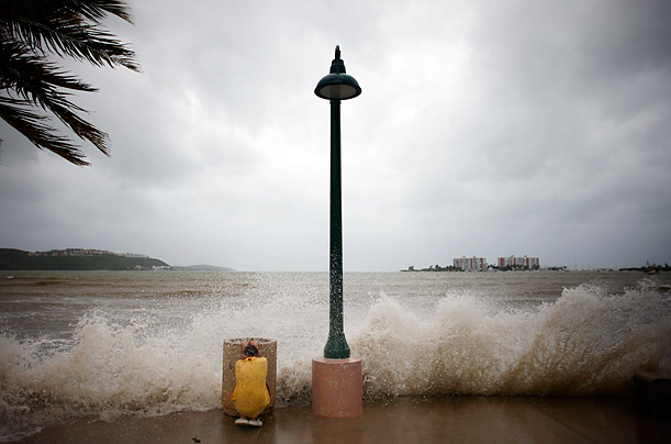 Duck and Cover

A boy takes cover in Fajardo, Puerto Rico from a wave caused by the approahc of Hurricane Earl.
