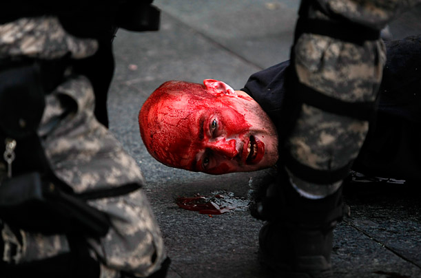 Riot police detain a man during an anti-gay protest in Belgrade, Serbia. Riot police clashed with hundreds of far-right supporters who tried to disrupt a gay pride march.




